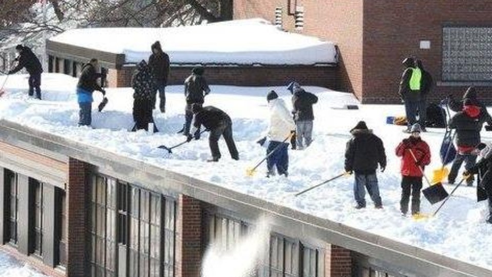 Workers Shoveling Snow